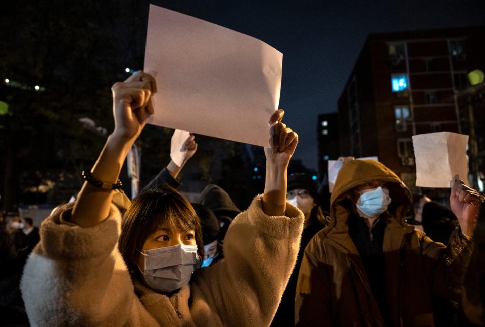 Protesters are raising blank A4 sheets, a symbol of defiance to signal how they are being silenced and also to taunt authorities as they cannot be arrested for holding signs saying nothing (Getty Images)