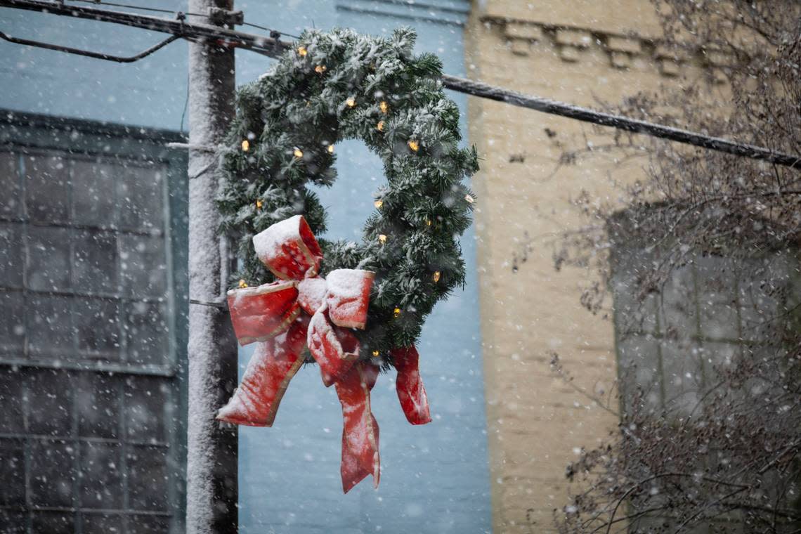 Snow sticks to remaining holiday decorations in downtown Hillsborough, N.C. on Monday, Jan. 3, 2022.
