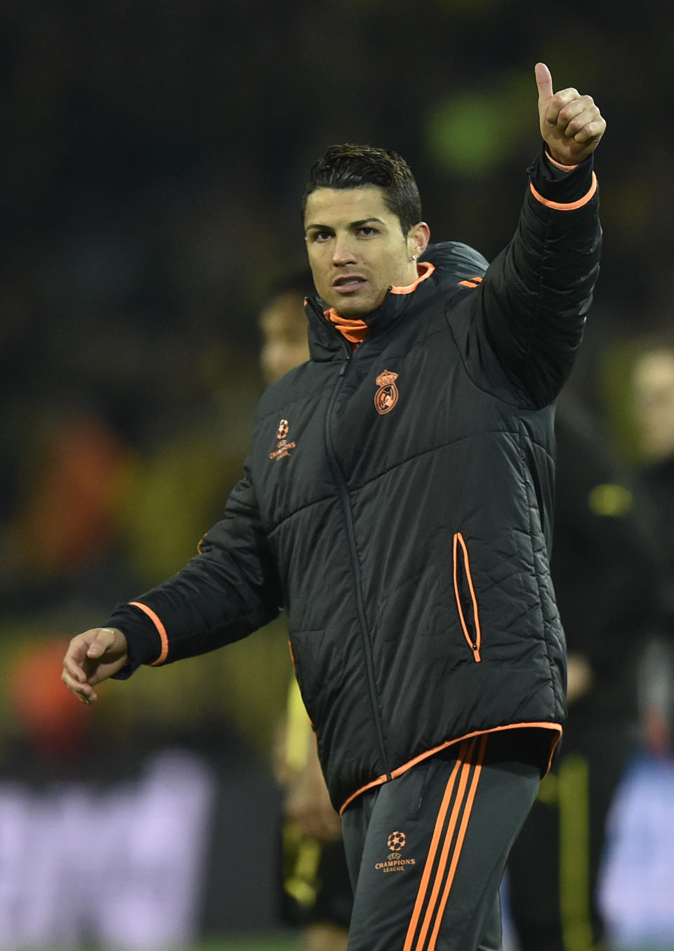 Real's Cristiano Ronaldo waves to his supporters at the end of the the Champions League quarterfinal second leg soccer match between Borussia Dortmund and Real Madrid in the Signal Iduna stadium in Dortmund, Germany, Tuesday, April 8, 2014. (AP Photo/Martin Meissner)