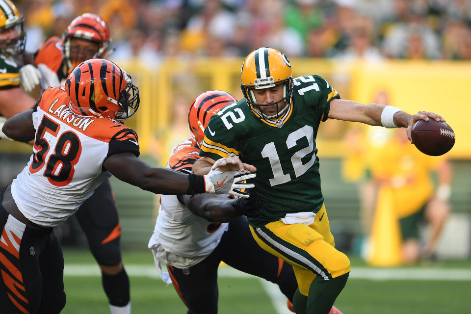 GREEN BAY, WI - SEPTEMBER 24:  Aaron Rodgers #12 of the Green Bay Packers is sacked by Carl Lawson #58 and Chris Smith #94 of the Cincinnati Bengals during the third quarter at Lambeau Field on September 24, 2017 in Green Bay, Wisconsin.  (Photo by Stacy Revere/Getty Images)