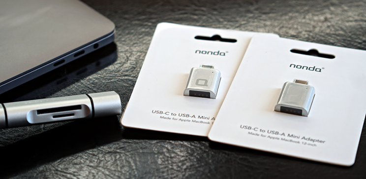 Meet your new adapters: an SD card reader (left), and a pair of USB adapters.