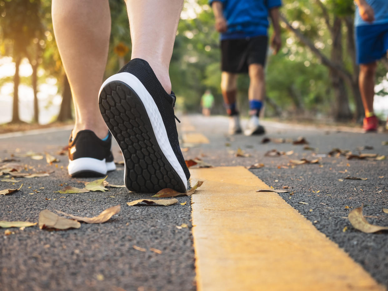 Man walk in park outdoor with People Jogging exercise Healthy lifestyle