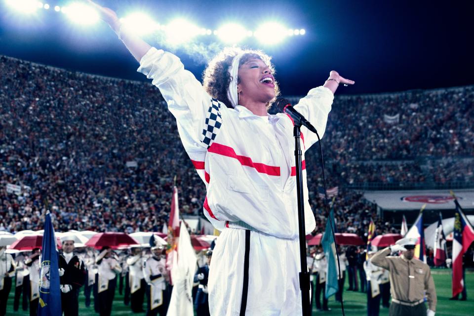 Whitney Houston (Naomi Ackie) performs an iconic national anthem at the 1991 Super Bowl in the music biopic "I Wanna Dance With Somebody."