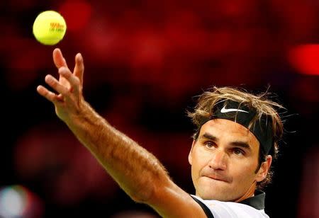 FILE PHOTO: Tennis - Match for Africa 3 - Federer v Murray - Zurich, Switzerland - 10/04/2017 - Switzerland's Roger Federer serves the ball during the Match for Africa 3 benefit tennis match against Andy Murray of Britain. REUTERS/Arnd Wiegmann