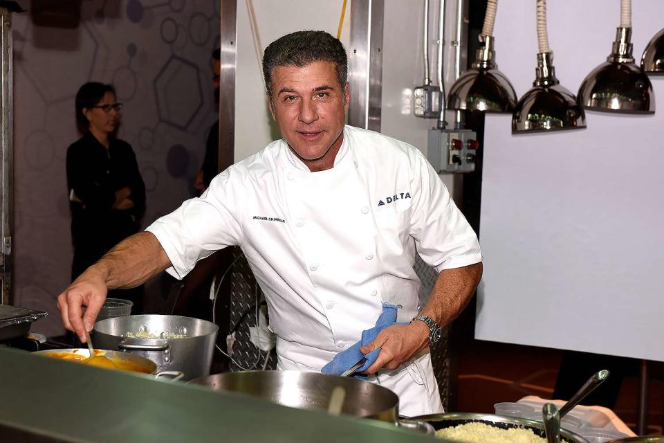 Chef Michael Chiarello prepares food at Delta Presents Food with Altitude