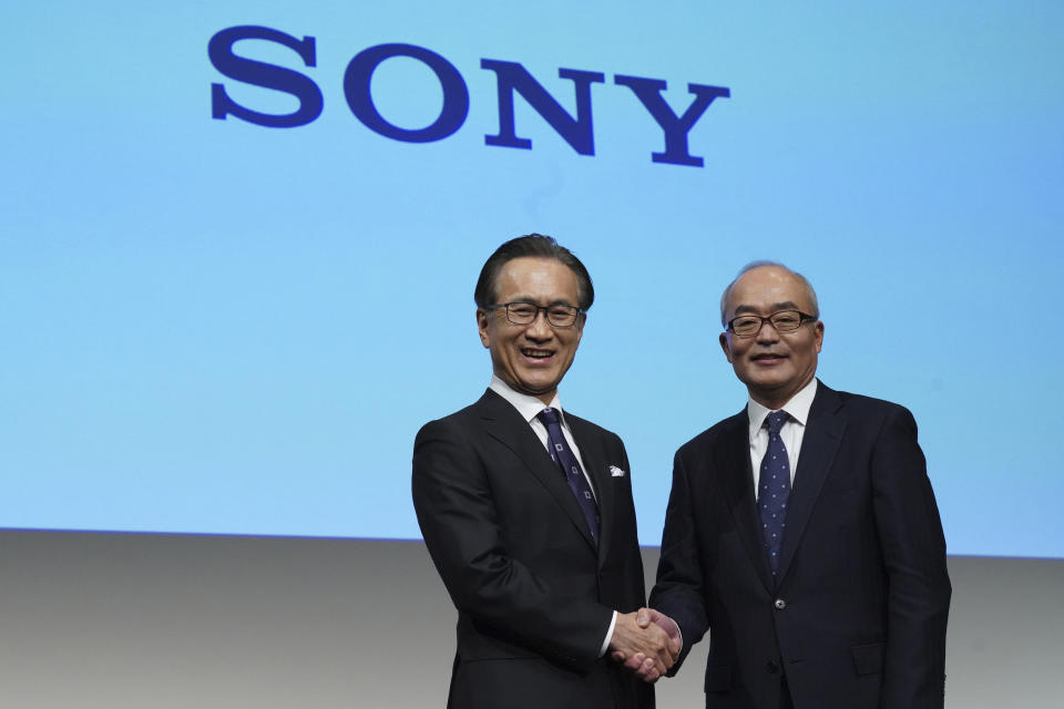 Hiroki Totoki, right, the Chief Financial Officer, who will become the president and COO, Sony Corp. and Kenichiro Yoshida, left, chief executive officer of Sony Corp. pose for media after a press conference Thursday, Feb. 2, 2023, in Tokyo. (AP Photo/Eugene Hoshiko)