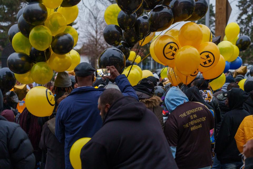 Community members gather Monday, Jan. 16, 2023, for a balloon release and memorial in honor of the late Richard Donnell Hamilton, or Coach Nell as he was known to the Indy Steelers youth football program. According to the Indiana State Police, Hamilton was shot during a road rage incident last week. 