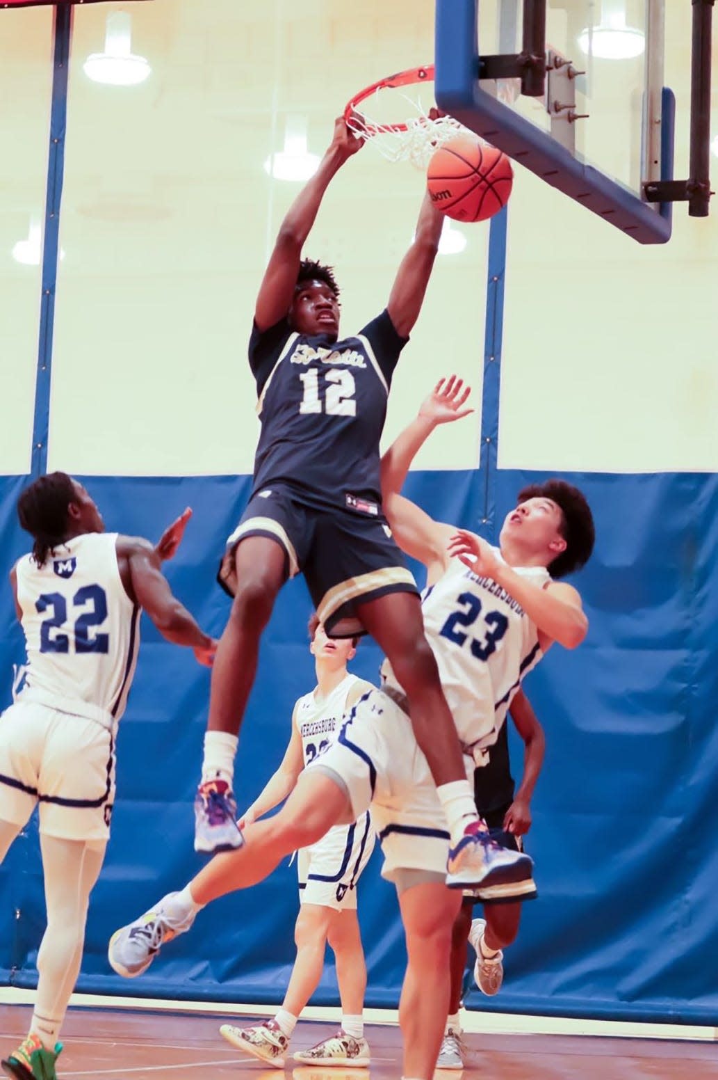 St. Maria Goretti's Najeh Allen dunks for two of his 29 points in a 78-71 victory over host Mercersburg in the Stuff the Basket mixer on Dec. 3, 2022.