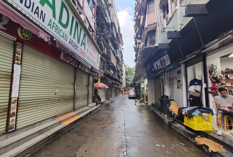 FILE PHOTO: A closed restaurant and shops are seen in Guangzhou's Xiaobei neighborhood