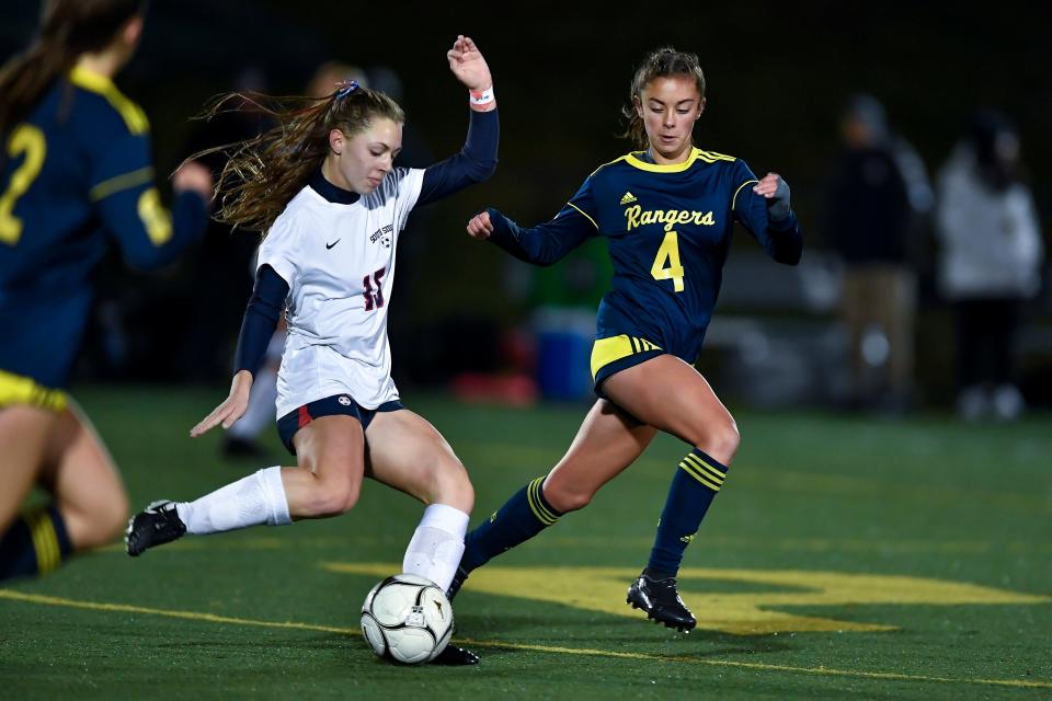 Lindsay Lenhard, right, and Spencerport moved into the top 10 in Class A.