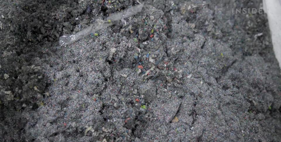 Rubber and foam that has been ground into powder at the FastFeedGrinded factory.