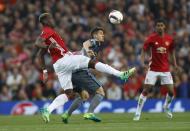 <p>Manchester United’s Paul Pogba in action with Celta Vigo’s Nemanja Radoja </p>