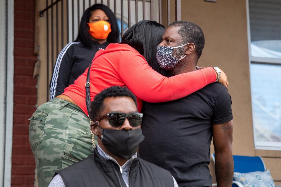 A neighbor gathers at a memorial outside Walter Wallace Jr.'s home in Philadelphia, Pa., Tuesday, Oct. 27, 2020.