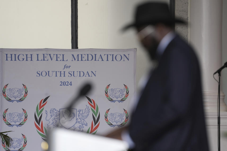 South Sudan's President Salva Kiir Mayardit, silhouetted, gives an address during the launch of high-level peace talks for South Sudan at State House in Nairobi, Kenya, on Thursday, May 9, 2024. (AP Photo/Brian Inganga)