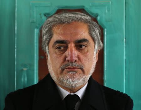 Afghanistan's Chief Executive Abdullah Abdullah visits locals following Sunday's suicide attack in Yahya Khail district, Paktika province November 24, 2014. REUTERS/Mohammad Ismail