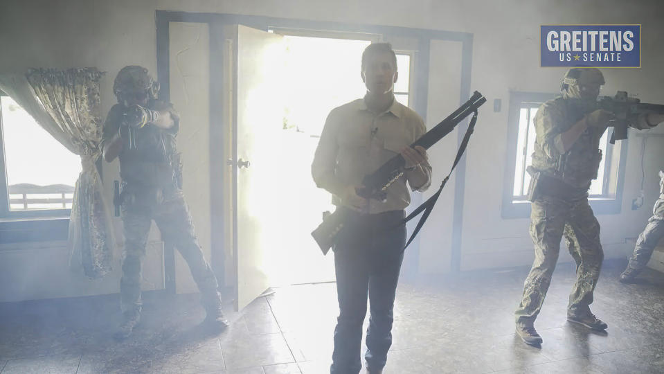 This image from video from a campaign ad by Eric Greitens for U.S. Senate, shows Greitens, a Republican candidate for U.S. Senate in Missouri, in a campaign video ad that shows him brandishing a long gun and declaring that he's hunting RINOs, or Republicans In Name Only. The video was scraped off Facebook within a few hours Monday, June 20, 2022. It remains live, however, on YouTube, where it's been watched thousands of times. You can also still see the video on Twitter, but you can't retweet it. (Courtesy of Eric Greitens for U.S. Senate via AP)