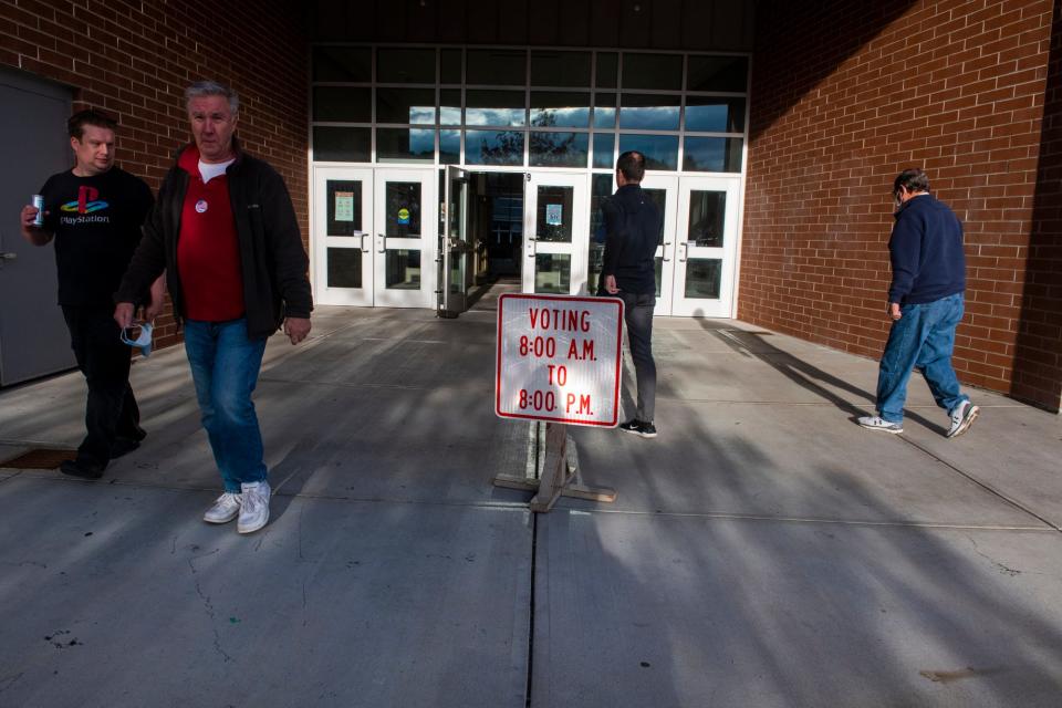 People walk near York High School while polls are open for the election on Nov. 2, 2021.