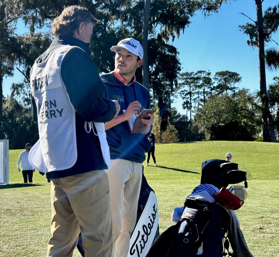 Former Jacksonville University golfer Raul Pereda (right) consults with caddie Anders Forsbrand before hitting his tee shot at the 10th hole of the TPC Sawgrass Dye's Valley on Monday during the final round of PGA Tour Q-School presented by Korn Ferry.