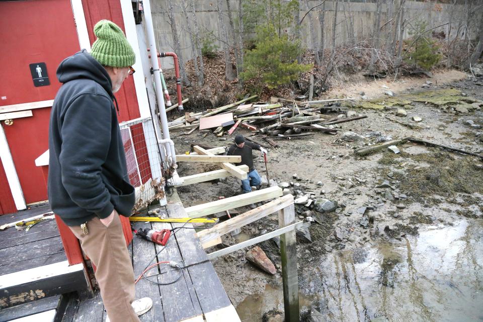 Chauncey Creek Lobster Pier owner Ron Spinney is repairing his business following the January storms. New pilings are put in by hand and much of the deck had to be rebuilt.