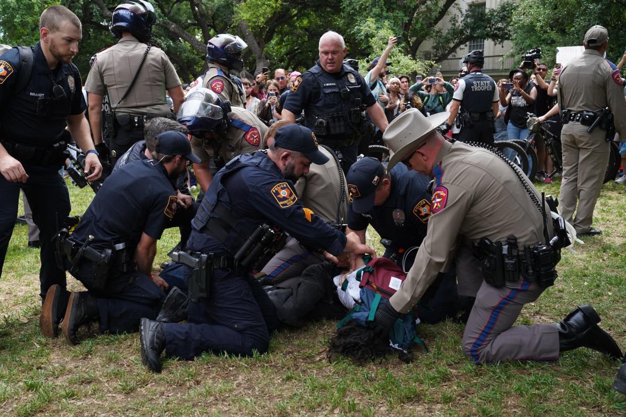 A person is detained by police as pro-Palestinian students protest the Israel-Hamas war on the campus of the University of Texas in Austin, Texas, on April 24, 2024.