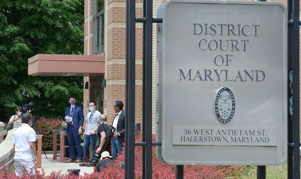 Members of the media wait outside the Washington County District Court in Hagerstown in May 2020 prior to the extradition hearing for Peter Manfredonia, who was wanted in two Connecticut slayings. Law enforcement took Manfredonia into custody the night before after a six-day manhunt.
