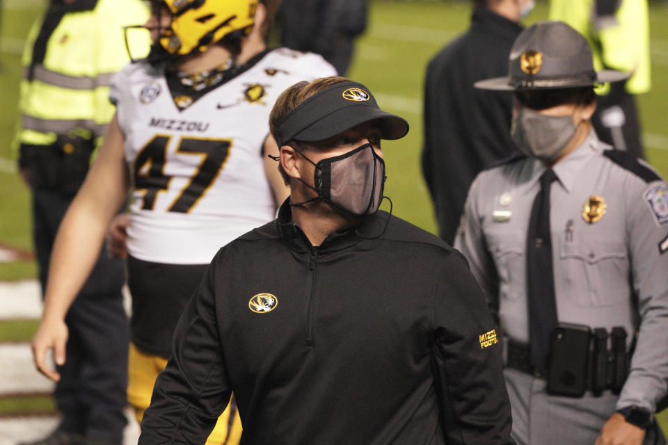 Missouri head coach Eliah Drinkwitz walks off the field after an NCAA college football game against South Carolina, Saturday, Nov. 21, 2020, in Columbia, S.C. (AP Photo/Sean Rayford)