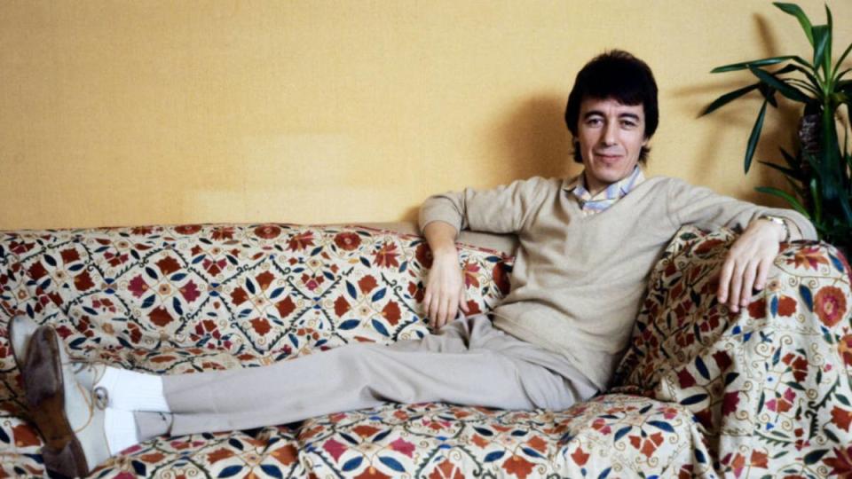 Bill Wyman sitting; Rolling stones members