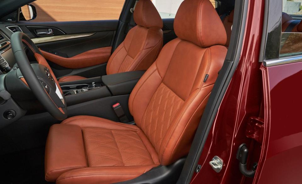 <p>Inside, Nissan upgraded the upholstery and dash materials-particularly on the SR model, which features diamond-quilted seats, orange stitching, and orange microsuede. </p>