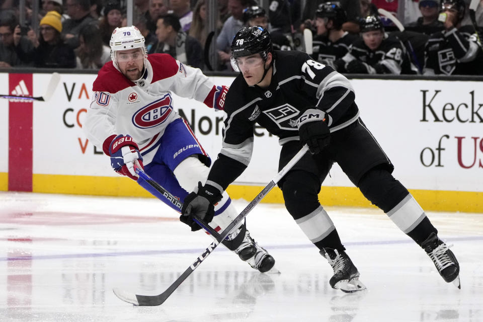Los Angeles Kings right wing Alex Laferriere is chased by Montreal Canadiens left wing Tanner Pearson during the third period of an NHL hockey game, Saturday, Nov. 25, 2023, in Los Angeles. (AP Photo/Marcio Jose Sanchez)