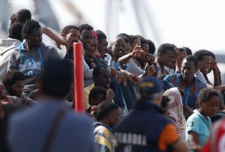 Migrants wait to disembark in the Sicilian harbour of Catania, Italy, May 28, 2016. REUTERS/Antonio Parrinello