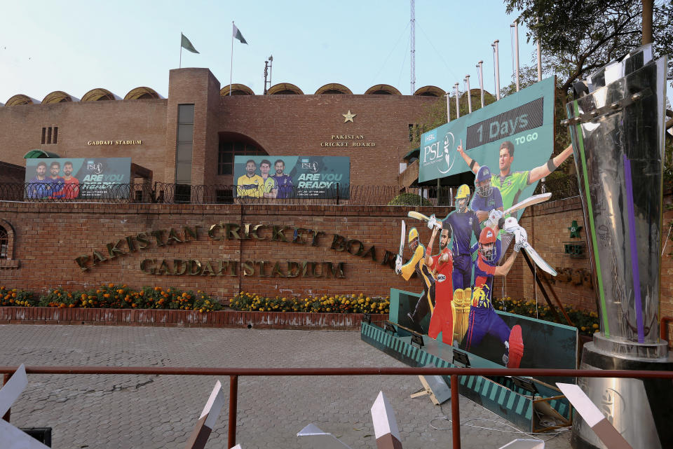 Cutouts of cricket players display outside the Gaddafi Stadium for the upcoming country's premier domestic Twenty20 tournament 'Pakistan Super League' in Lahore, Pakistan, Tuesday, Jan. 25, 2022. The Pakistan Cricket Board says "robust" COVID-19 health and safety protocols are in place ahead of its month-long domestic Twenty20 competition in Karachi and Lahore, with several foreign cricketers participating in a six-team event. (AP Photo/K.M. Chaudary)