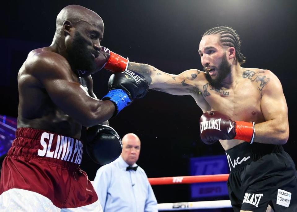 TULSA, OKLAHOMA - AUGUST 26: Sona Akale (L) and Nico Ali Walsh (R) exchange punches during their middleweight fight at Hard Rock Live on August 26, 2023 in Tulsa, Oklahoma. (Photo by Mikey Williams/Top Rank Inc via Getty Images)