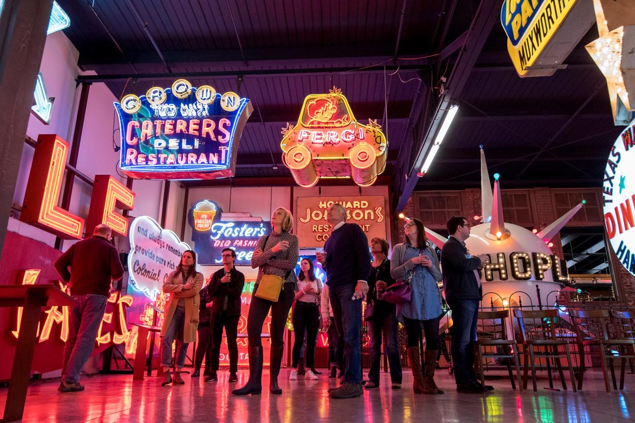 Guests get a private tour of the American Sign Museum while tasting some special Rhinegeist beers during Signs and Suds Thursday, January 24, 2019 in Cincinnati, Ohio.