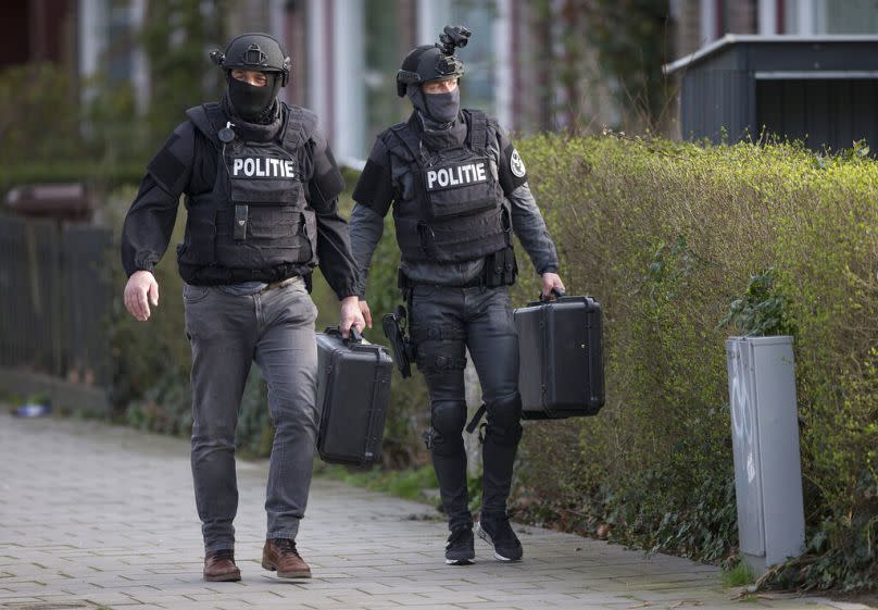 Dutch counter terrorism police leave after searching a house following a shooting incident in Utrecht, March 2019