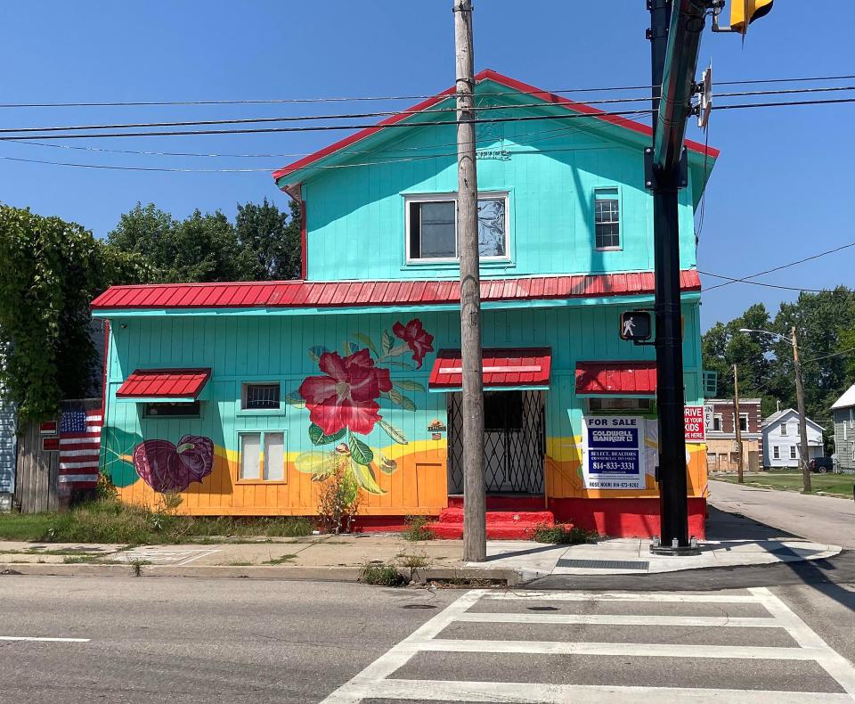 This property at 560 E. 12th St. was formerly known as the Ash Street Pub and was later the base for a food truck. Its outside was painted in 2022 as part of a public art mural project.