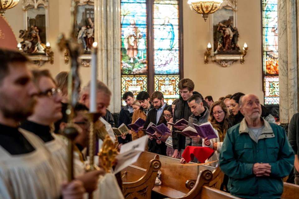 Parishioners from St. Aloysius, center, take part in a service during the Stations of the Cross at Sweetest Heart of Mary Church in Detroit on Friday, March 17, 2023.