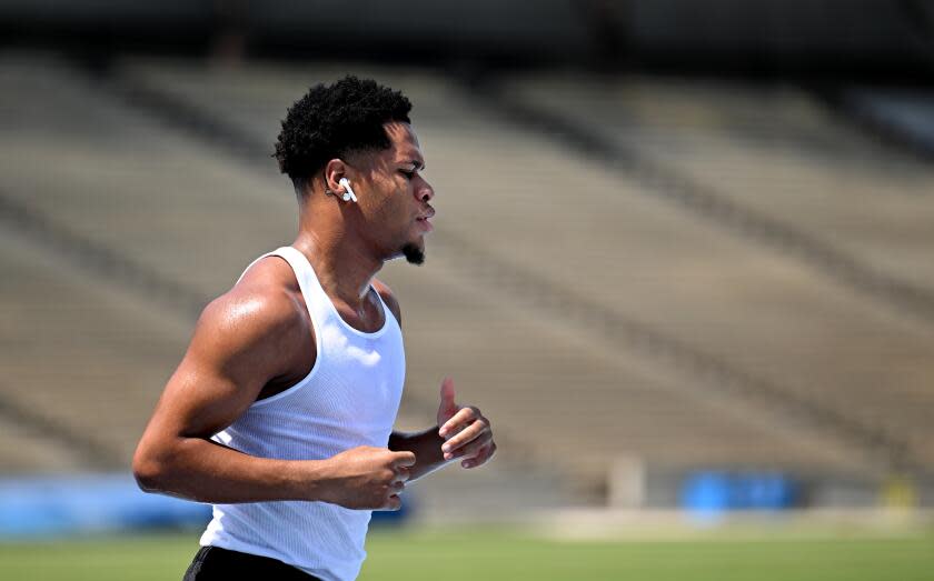 Boxer Devin jogs on the track at Drake Field on the UCLA campus in Los Angeles.
