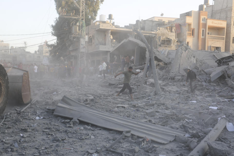 Palestinians look for survivors after an Israeli strike on the Gaza Strip in Rafah on Monday, Nov. 6, 2023. (AP Photo/Hatem Ali)