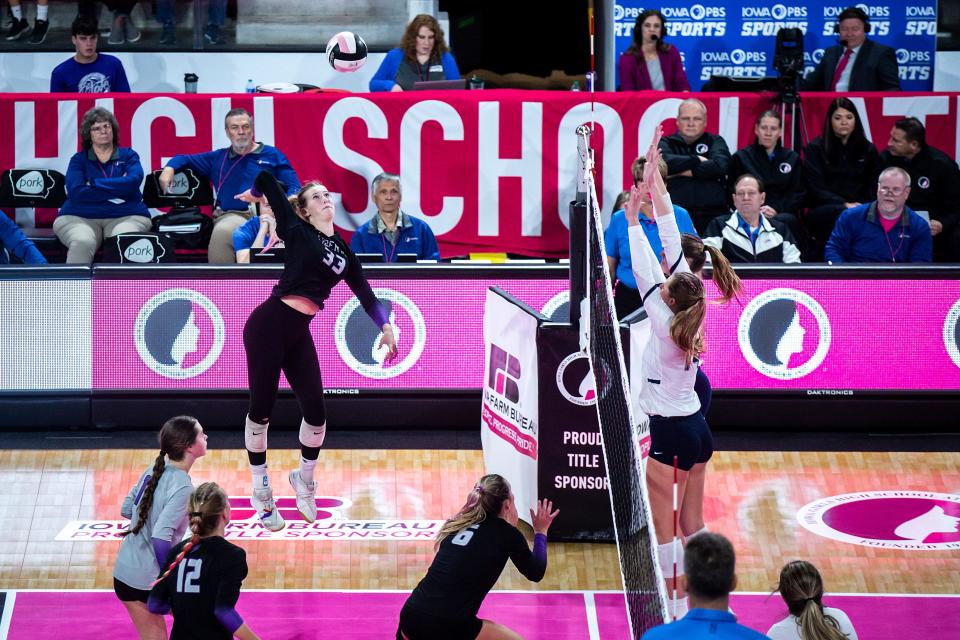Iowa City Liberty's Cassidy Hartman (33) goes up for an attack during a Class 5A state volleyball championship match