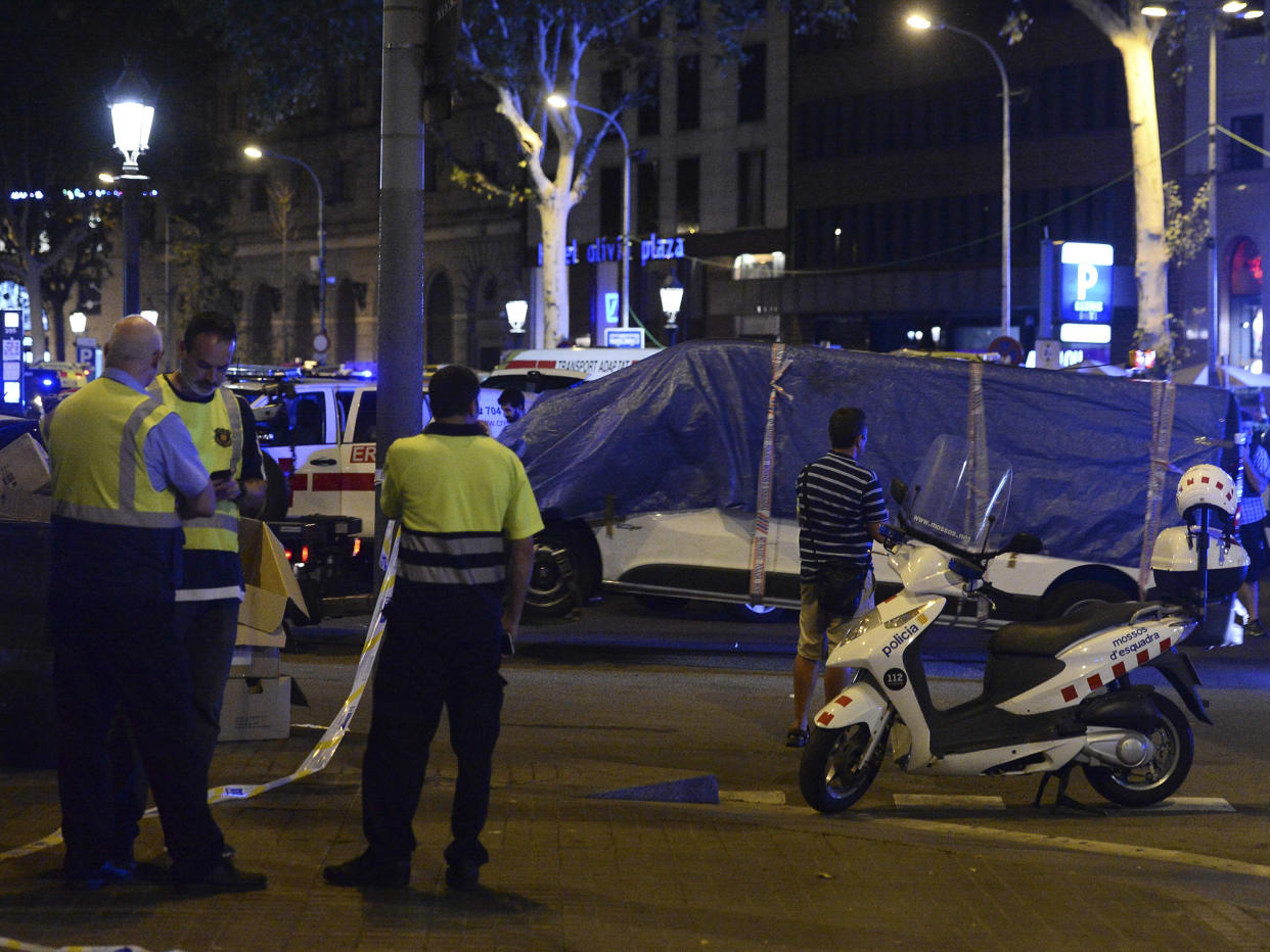 The van that ploughed into the crowd, killing 13 people and injuring around 100 others, is towed away from La Rambla in Barcelona: AFP/Getty Images