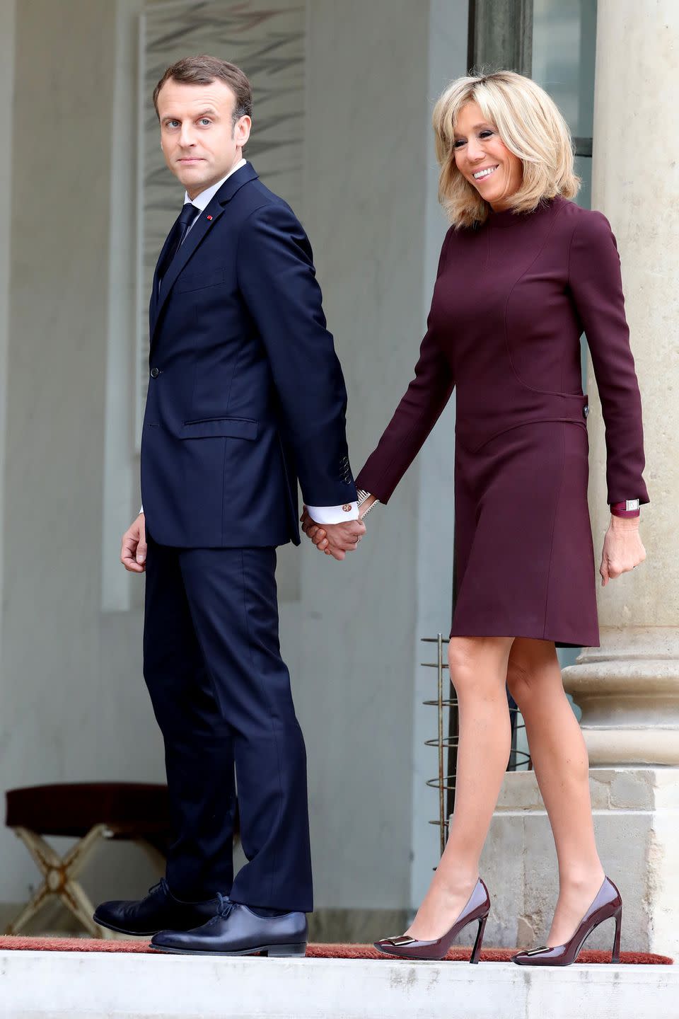 <p>Wearing a maroon dress and matching pumps for a meeting with Lebanese Prime Minister Saad Hariri at the Elysee Palace. </p>