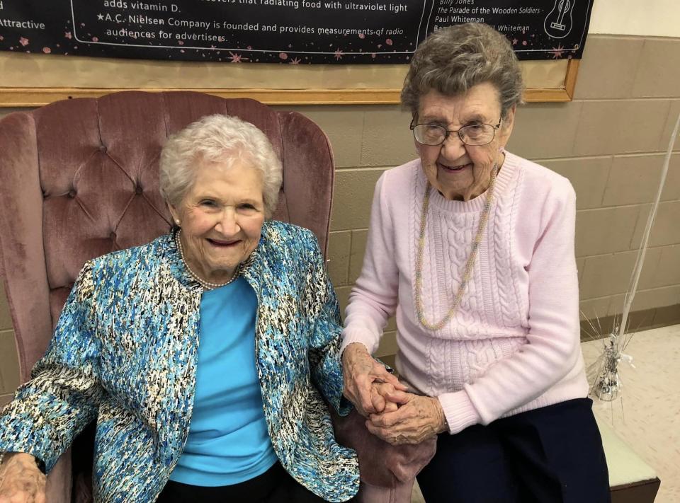 Centenarians Arlene Layne Stanton of Enon and Frances Bailey of Richmond strike a pose at Stanton's 100th birthday celebration.