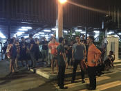 <p>Employees and onlookers gather outside the Resorts World Manila complex, early Friday, June 2, 2017, in Manila, Philippines. Gunshots and explosions rang out early Friday at a mall, casino and hotel complex near Manila's international airport in the Philippine capital, sparking a security alarm amid an ongoing Muslim militant siege in the country's south. (AP Photo/Bullit Marquez) </p>