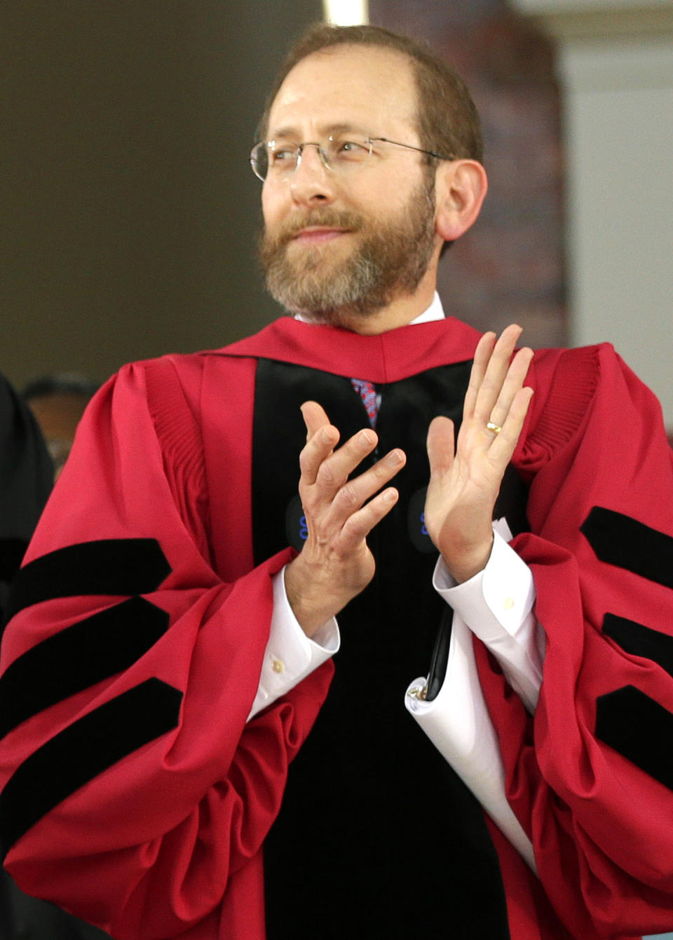 FILE - Harvard University Provost Alan Garber applauds during commencement exercises, Thursday, May 28, 2015, in Cambridge, Mass. Garber, provost and chief academic officer, will serve as interim president until Harvard finds a replacement for Claudine Gay, who resigned Tuesday Jan. 2, 2024, amid plagiarism accusations and criticism over testimony at a congressional hearing where she was unable to say unequivocally that calls on campus for the genocide of Jews would violate the school’s conduct policy. (AP Photo/Steven Senne, File)