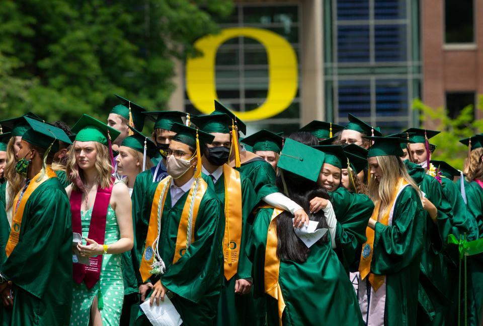 Graduates line up on the Quad for a livestream walk through at the University of Oregon 2021 Commencement.