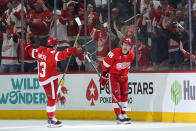 Detroit Red Wings right wing Patrick Kane (88) celebrates his goal with Alex DeBrincat (93) in the second period of an NHL hockey game against the Buffalo Sabres, Saturday, March 16, 2024, in Detroit. (AP Photo/Paul Sancya)