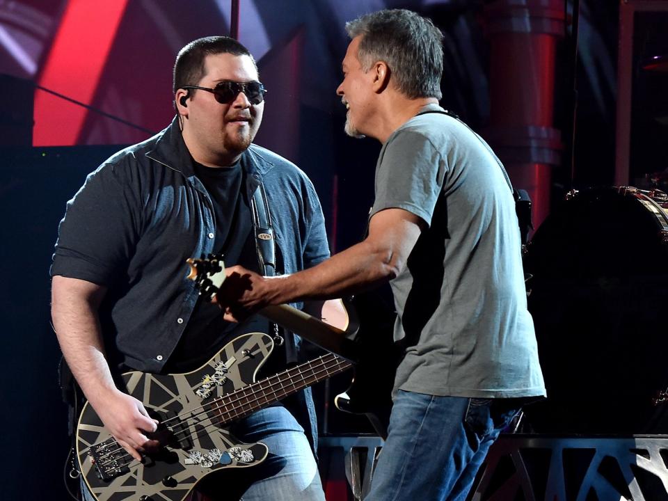 Wolfgang Van Halen (L) and Eddie Van Halen of Van Halen perform onstage at the 2015 Billboard Music Awards at MGM Grand Garden Arena on May 17, 2015 in Las Vegas, Nevada