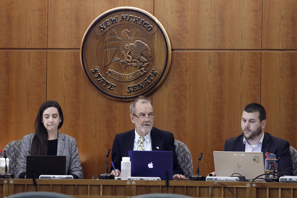 Members of the New Mexico Water Quality Control Commission, including Chairman Bruce Thomson, center, gather in Santa Fe, N.M., Monday, May 13, 2024. Environmental officials in the nation's No. 2 state for petroleum production are taking initial steps toward regulating the treatment and reuse of oil-industry fracking water. New Mexico has been grappling with scarce water supplies, and fossil fuel producers are confronting shrinking opportunities for water disposal. (AP Photo/Morgan Lee)