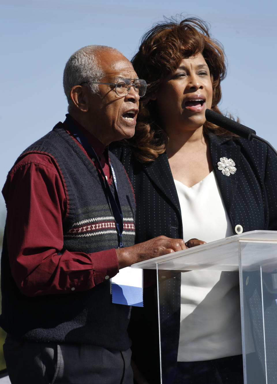 FILE - Hollis Watkins, left, chairman of the Veterans of the Mississippi Civil Rights Movement, and Cynthia Goodloe Palmer, right, executive director of the group, sing "This Little Light of Mine" during a groundbreaking ceremony for the Museum of Mississippi History and the Mississippi Civil Rights Museum in Jackson, Miss., Thursday, Oct. 24, 2013. Watkins was 82 when he died Wednesday, Sept. 20, 2023, at his home in Clinton, Miss. (AP Photo/Rogelio V. Solis, File)