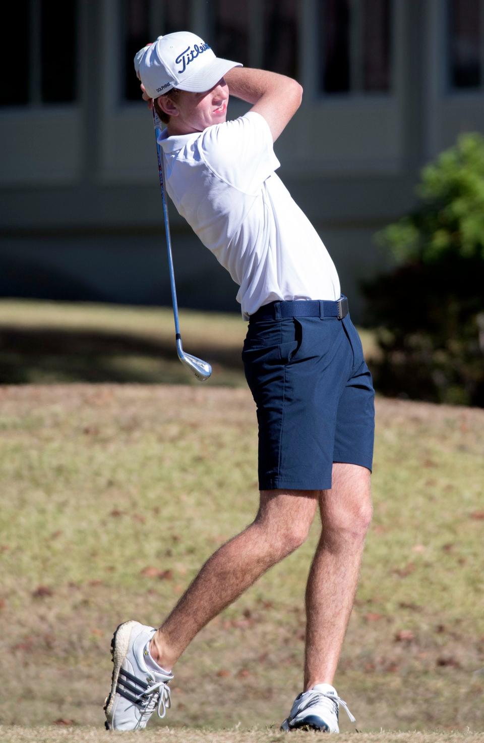 Gulf Breeze High School's Mark Piver  watches the flight of his tee shot while playing the front nine during the District 1-3A meet at Stonebrook Golf Club on Monday, Oct. 24, 2022. 
